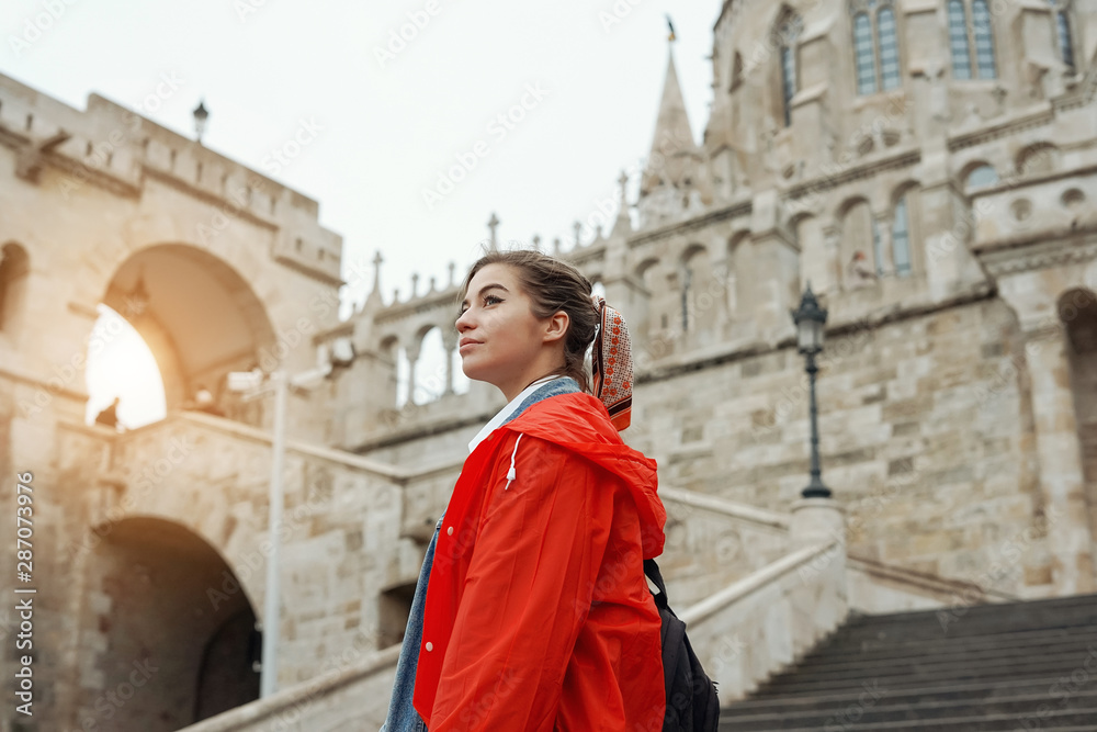 Young woman with blonde hair in the Fisherman's Bastion in the Castle district of Budapest