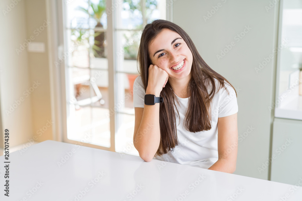 Beautiful young brunette woman smiling cheerful looking at the camera with a big smile on face showing teeth Beautiful young brunette woman smiling cheerful looking at the camera with a big smile on face showing teeth