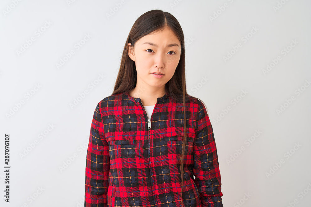 Young chinese woman wearing casual jacket standing over isolated white background looking sleepy and tired, exhausted for fatigue and hangover, lazy eyes in the morning. Young chinese woman wearing casual jacket standing over isolated white background looking sleepy and tired, exhausted for fatigue and hangover, lazy eyes in the morning.