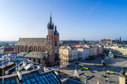 Krakow, Poland. Aerial view of old town, with Main Market Square (Rynek), St. Mary Gothic church (Mariacki), Mickiewicz statue, St. Adalbert small church and far view of Wawel castle and cathedral