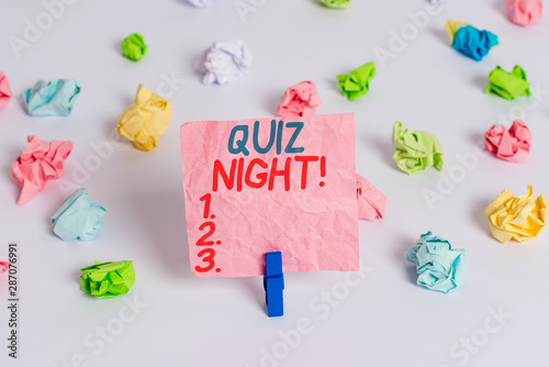 Conceptual hand writing showing Quiz Night. Concept meaning evening test knowledge competition between individuals Colored crumpled paper empty reminder white floor clothespin