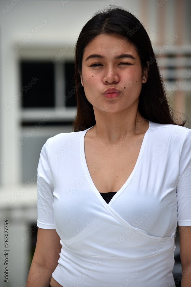 A Beautiful Asian Female Winking A Beautiful Asian Female Winking