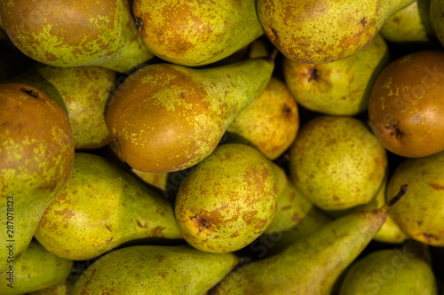 Juicy ripe pears in pile close-up. Good choice for smoothie ingridient. Fruit background.