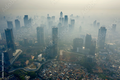 Fotografi Air pollution scenic with residential and skyscrapers