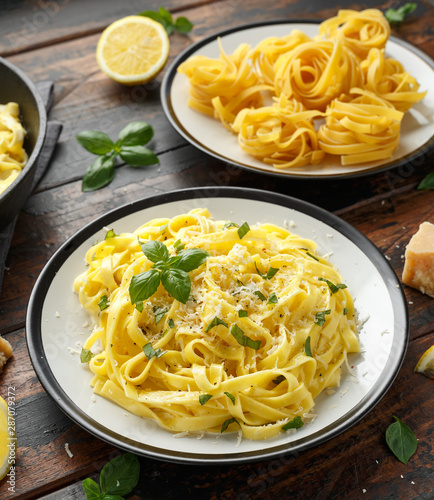 Pasta al Limone, Lemon with basil and parmesan cheese on wooden table