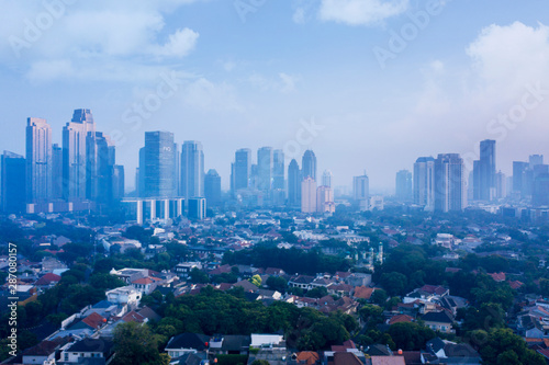 Dense residential at misty morning in Jakarta city