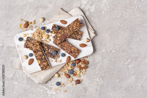 Granola bar with fresh blueberry and nuts for healthy nutrition