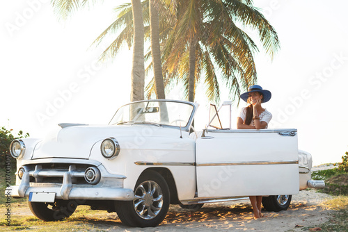 Happy young woman and retro convertible car © blackday