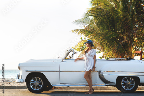 Happy young woman and retro convertible car © blackday