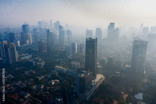Jakarta cityscape with skyscraper and air pollution