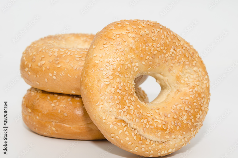 Tasty bagel with sesame seed isolated on white background Tasty bagel with sesame seed isolated on white background