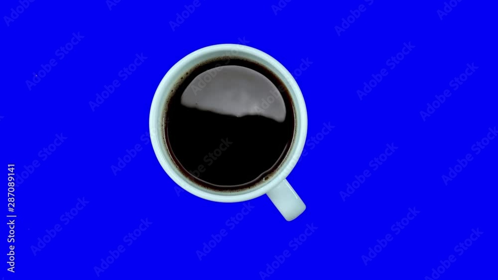 Small coffee cup with white coffee on saucer rotating on blue screen, loop, top view. Alpha channel. Small coffee cup with white coffee on saucer rotating on blue screen, loop, top view. Alpha channel.