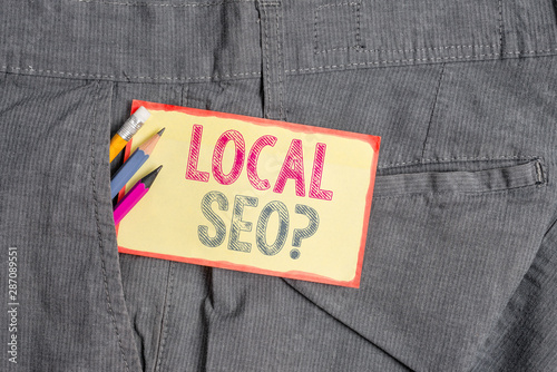 Conceptual hand writing showing Local Seoquestion. Concept meaning incredibly effective way to market your local business online Writing equipment and yellow notepaper in pocket of trousers
