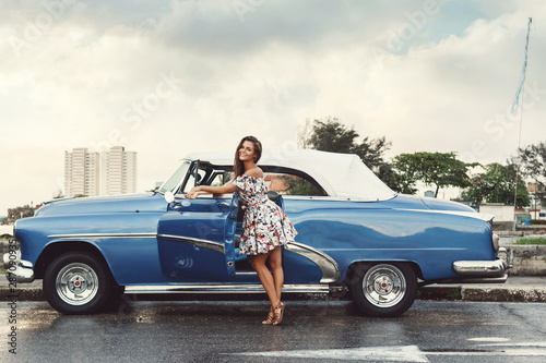 Photography Beautiful woman driving a retro convertible car