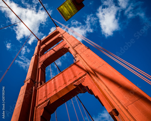 Abstract close up the north tower of the golden gate bridge contrasting with deep blue sky