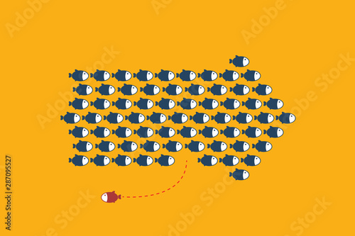 Think differently -One red unique different fish swimming opposite way of identical blue ones.	