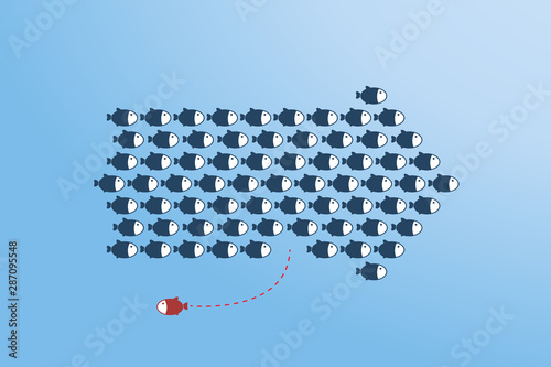 Think differently -One red unique different fish swimming opposite way of identical blue ones.	