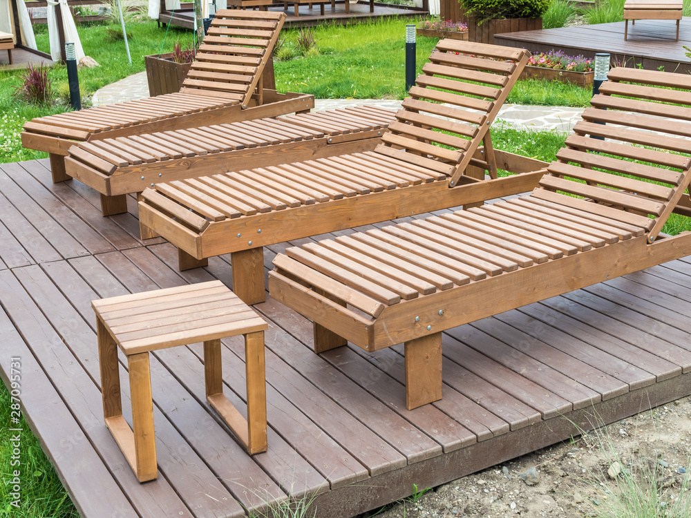 Wooden sunbeds for relaxing in the park at Rosa Khutor Wooden sunbeds for relaxing in the park at Rosa Khutor