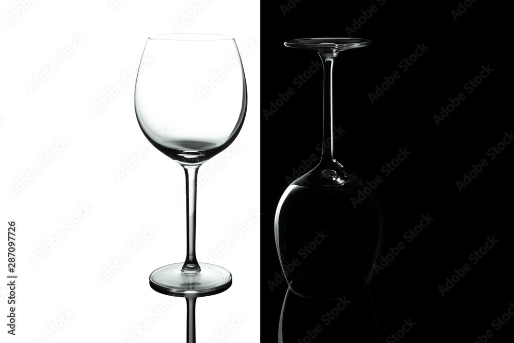 Empty wine glasses for wine isolated on black and white background. Wine list design menu with copy space. Alcohol beverage card backdrop. Empty wine glasses for wine isolated on black and white background. Wine list design menu with copy space. Alcohol beverage card backdrop.