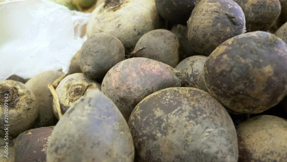 beets in a container in a supermarket, background. view from above. beets in a container in a supermarket, background. view from above.