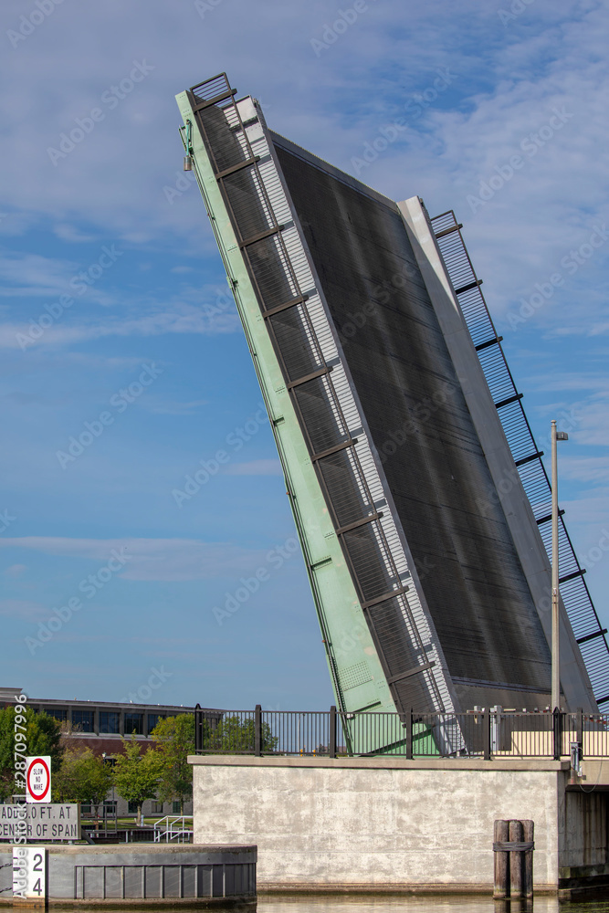 Manitowoc,WI,USA August 31, 2019 : lifting drawbridge over Manitowoc river Manitowoc,WI,USA August 31, 2019 : lifting drawbridge over Manitowoc river