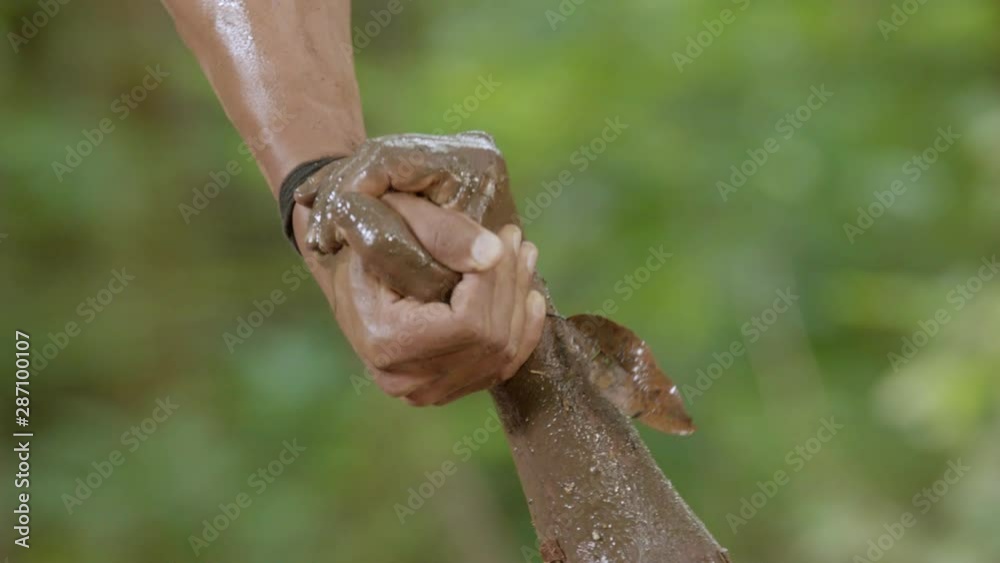Holding two hands in the background of nature. Helping a friend, People help the farmer