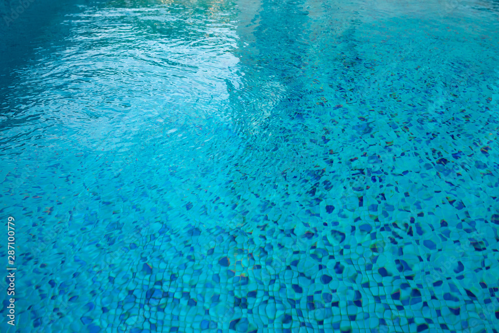 Swimming pool blue mosaic rock bottom. Texture.