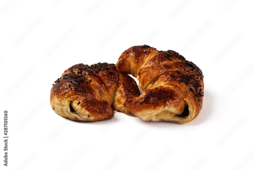 stack of two chocolate croissants isolated on white background