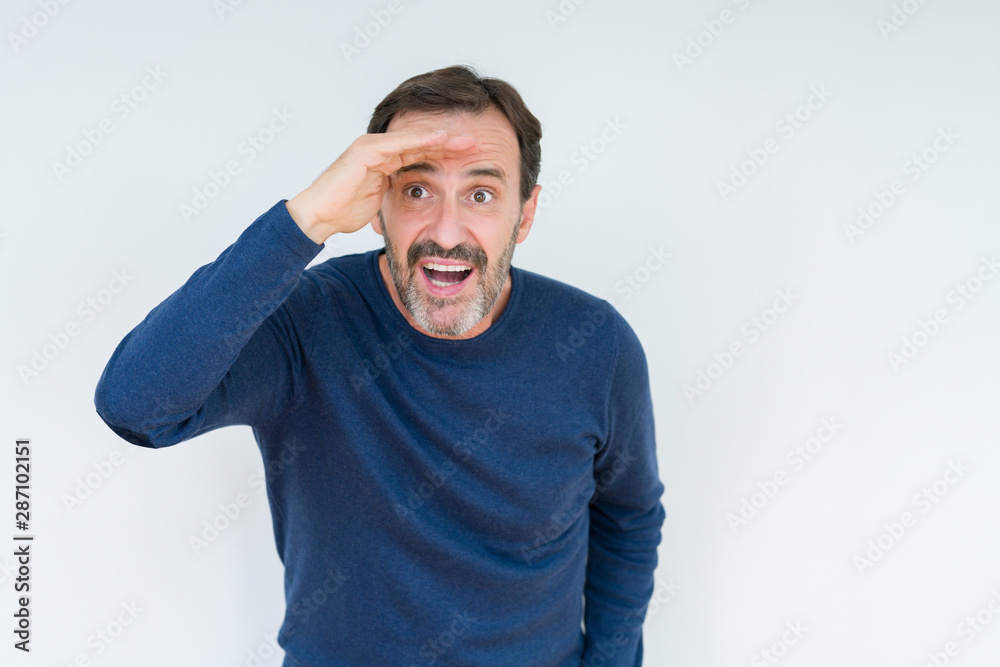 Elegant senior man over isolated background very happy and smiling looking far away with hand over head. Searching concept. Elegant senior man over isolated background very happy and smiling looking far away with hand over head. Searching concept.
