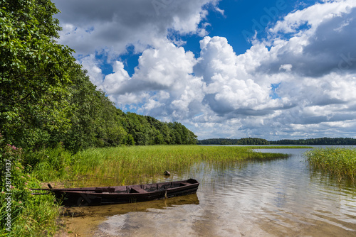 Fototapeta Naklejka Na Ścianę i Meble -  Fishing boat on Lake Plateliai in the Samogitia National Park; Lithuania