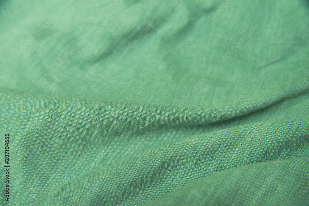 creased green textile background texture creased green textile background texture