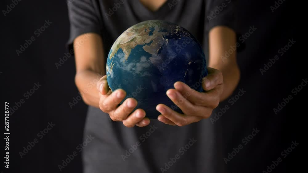 Female hand holding a realistic Earth. Holding the world in your hand. Rotation planet. Earth globe. World map design. Global sphere planet. Texture map courtesy of NASA. Female hand holding a realistic Earth. Holding the world in your hand. Rotation planet. Earth globe. World map design. Global sphere planet. Texture map courtesy of NASA.