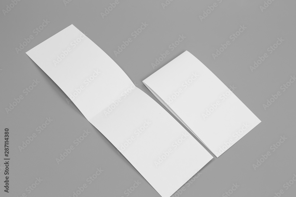 Blank portrait mock-up paper. brochure magazine isolated on gray, changeable background / white paper isolated on gray Blank portrait mock-up paper. brochure magazine isolated on gray, changeable background / white paper isolated on gray
