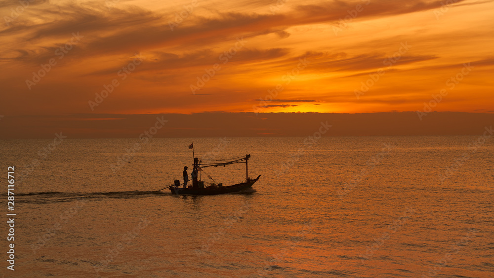 silhouette fisherman boat on seascape with sunrise skyline