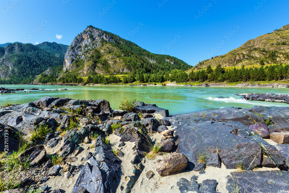 Fototapeta premium Colored stones at the Katun river. Gorny Altai, Siberia, Russia