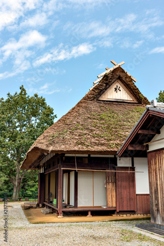 A traditional thatched roof Japanese house  preserved at a public park in Sanda, Hyogo, Japan.  