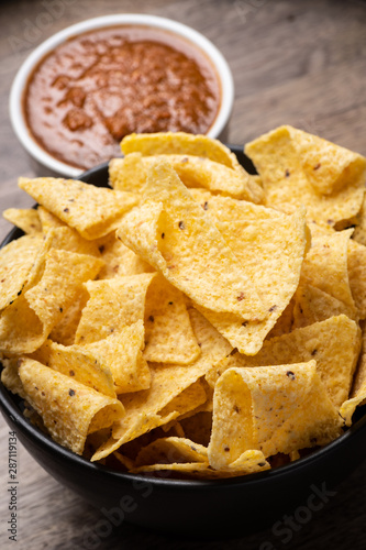 Bowl of corn tortilla chips and salsa photo