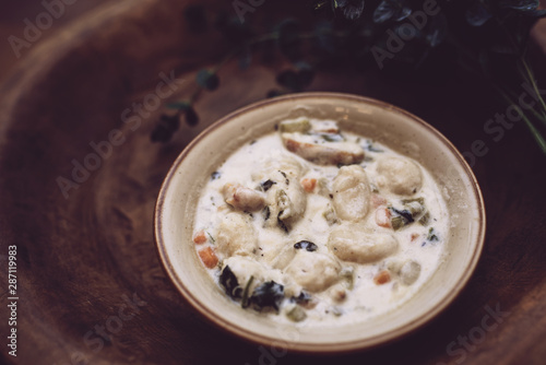 Traditional Italian chicken gnocchi soup in a bowl