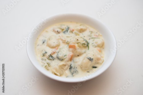 Traditional Italian chicken gnocchi soup in a bowl