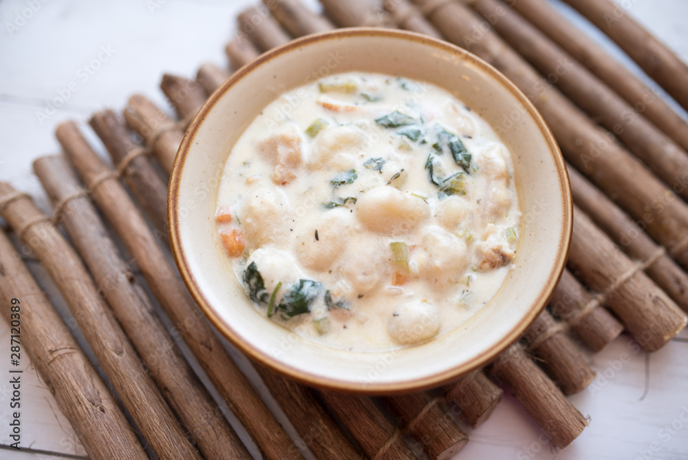 Traditional Italian chicken gnocchi soup in a bowl Traditional Italian chicken gnocchi soup in a bowl
