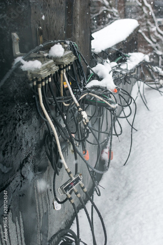 A huge mess of cables on a rooftop in Harlem, New York, USA
