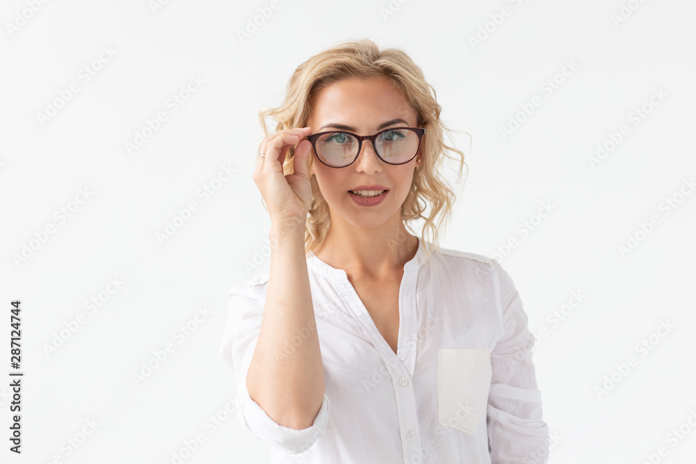 Attractive young woman with spectacles on white background. Vision glasses. Optics shop.