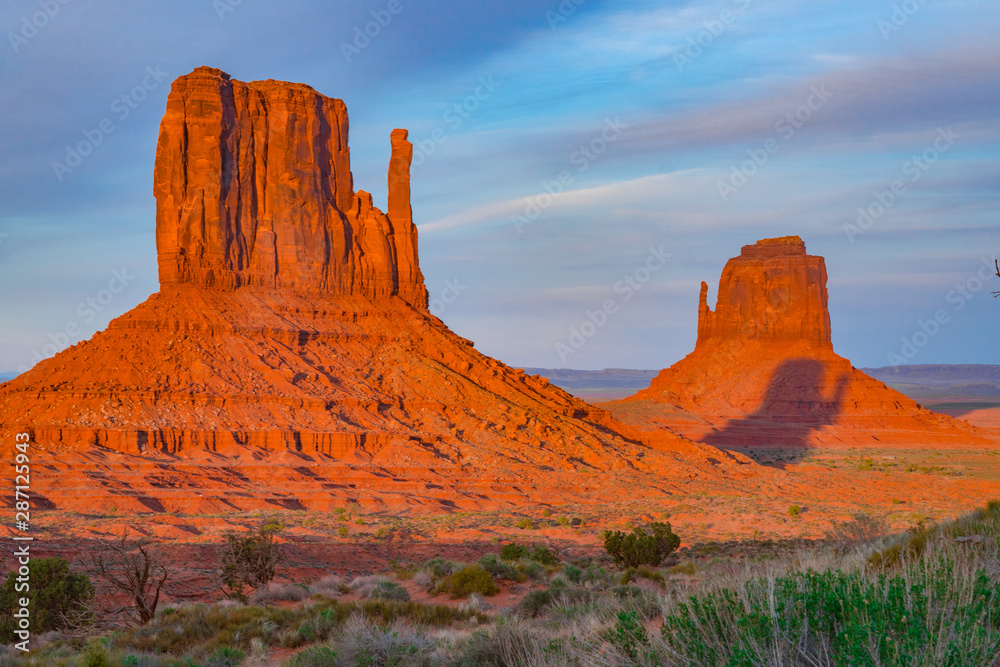 Colorful Sunset and Glowing Red Rock Features in Monument Valley