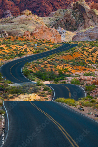 Travel down a winding desert road toward adventure
