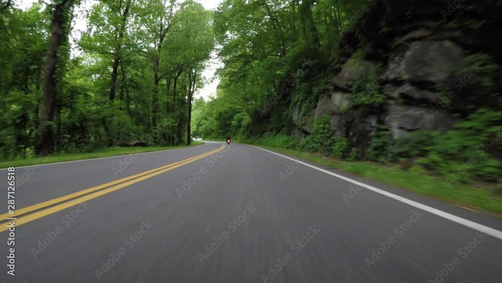 Following a Motorcycle in Great Smoky Mountains in early summer Following a Motorcycle in Great Smoky Mountains in early summer