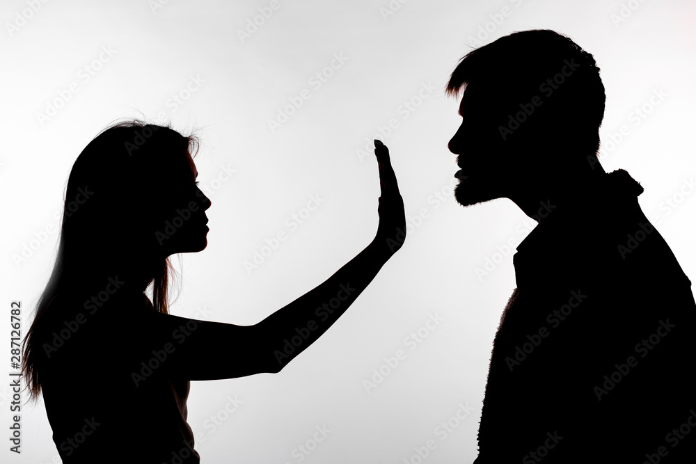 Man abusing woman, silhouette on a white background. Stop sexual assault