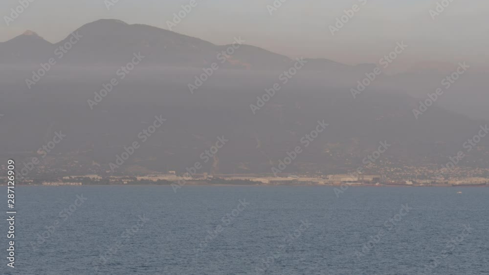 Smog around industry area on sea shore Smog around industry area on sea shore