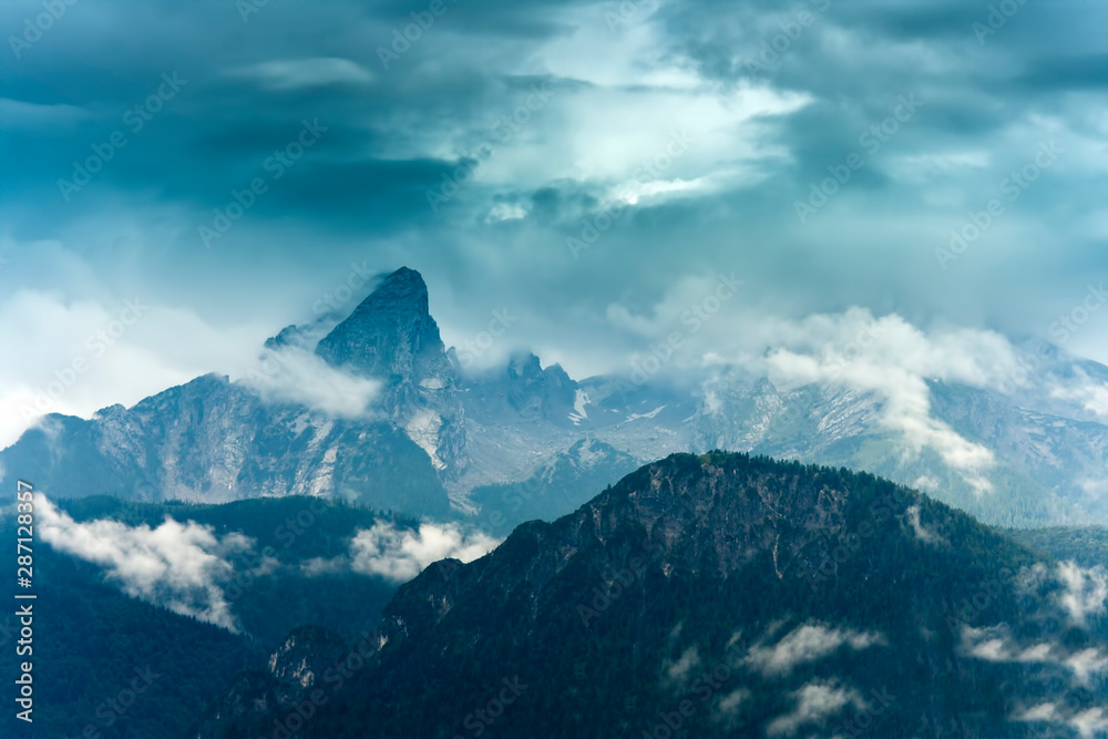 Watzmann peak in Germany Alps. dark scene with fog Watzmann peak in Germany Alps. dark scene with fog
