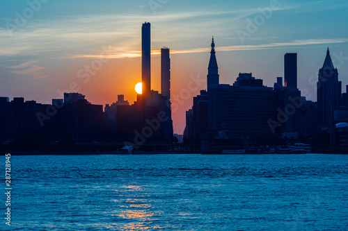 Manhattanhenge is one of the Summer's most fantastic event  at Manhattan New York . 2019 July 10th and 12th were the best weather condition to watch the fantastic  Manhattanhenge. photo