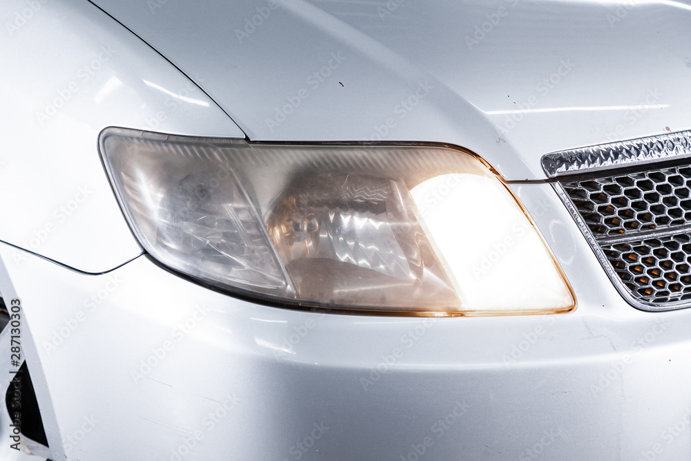 Car headlights. Exterior detail. Close up detail on one of the LED headlights modern car..